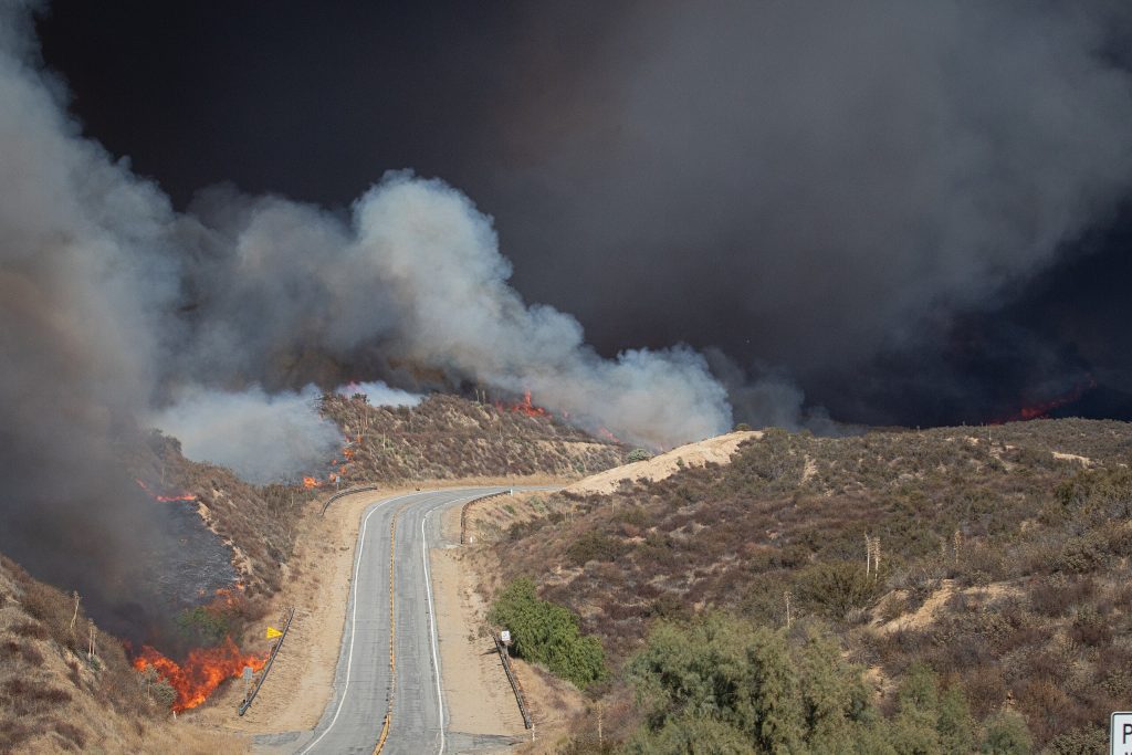 Hughes Fire burning on 22 January 2025 and firefighters with United States Forest Service (USFS)