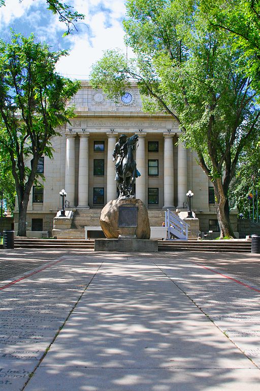 North side of the County Courthouse with Buckey O'Neil statue in foreground, by the City of Prescott. Licensed under the Creative Commons Attribution-Share Alike 3.0 Unported license.