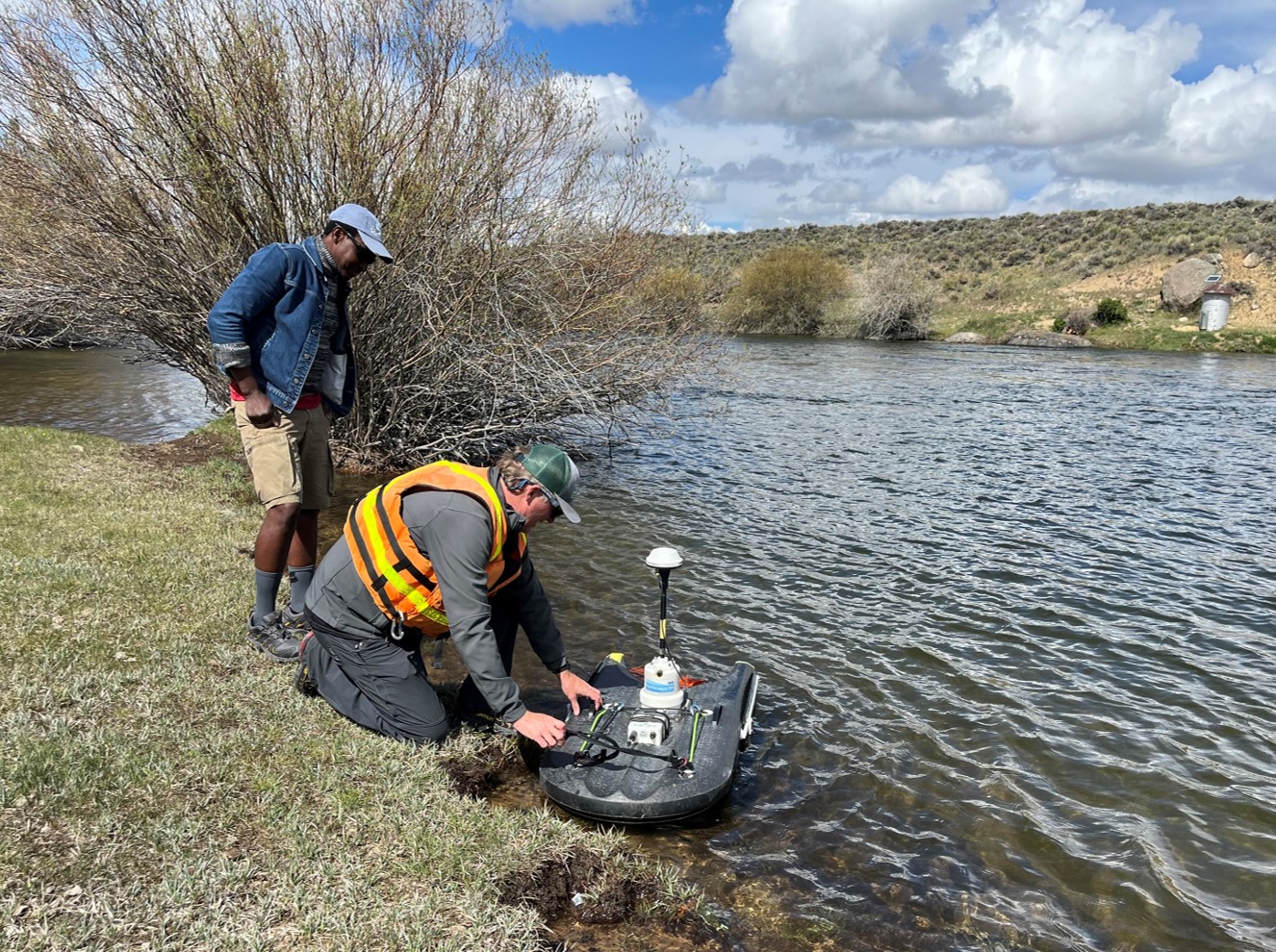 Staff measuring USGS stream gage