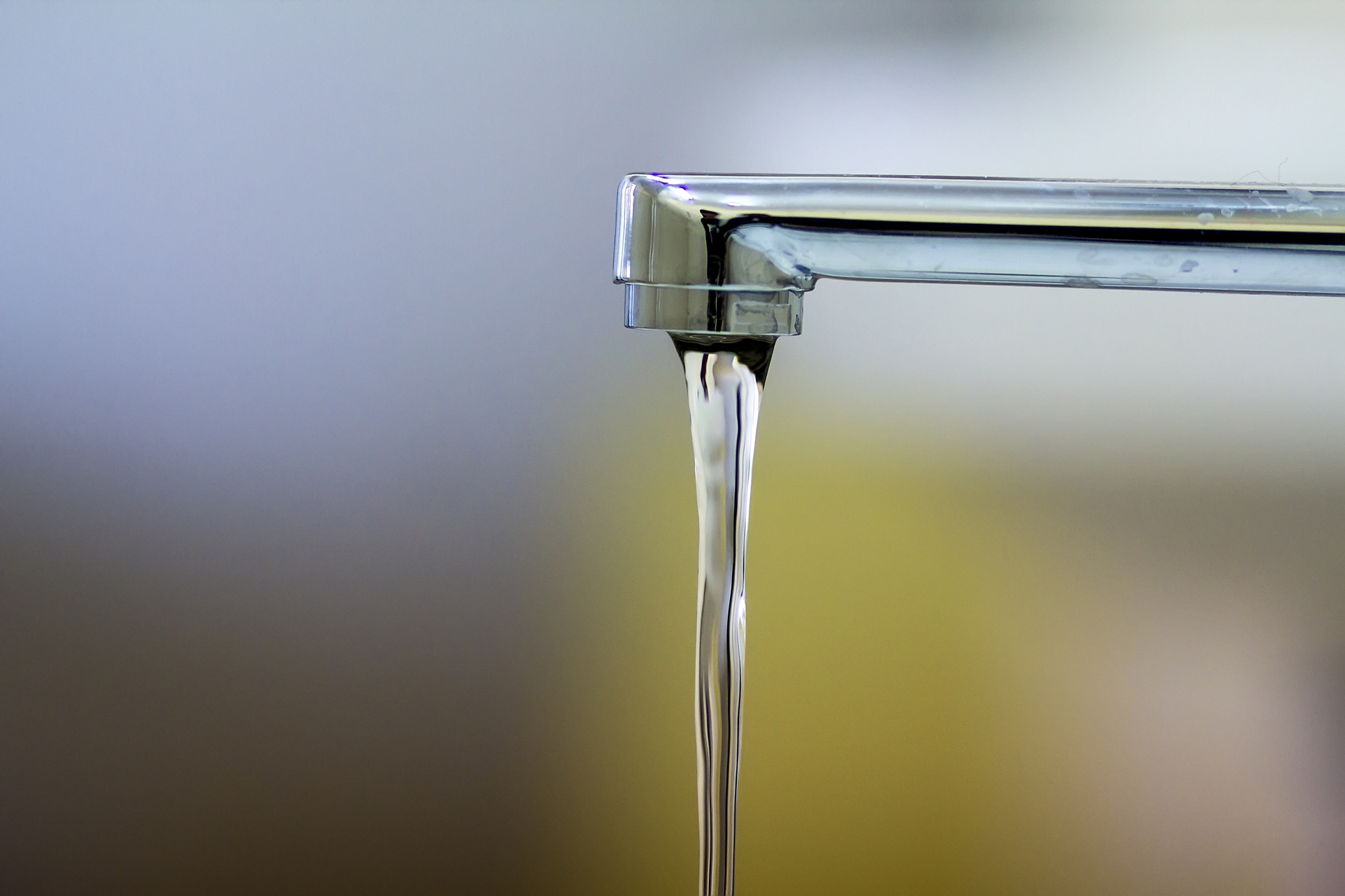 Close-up of running faucet depicting clean water supply