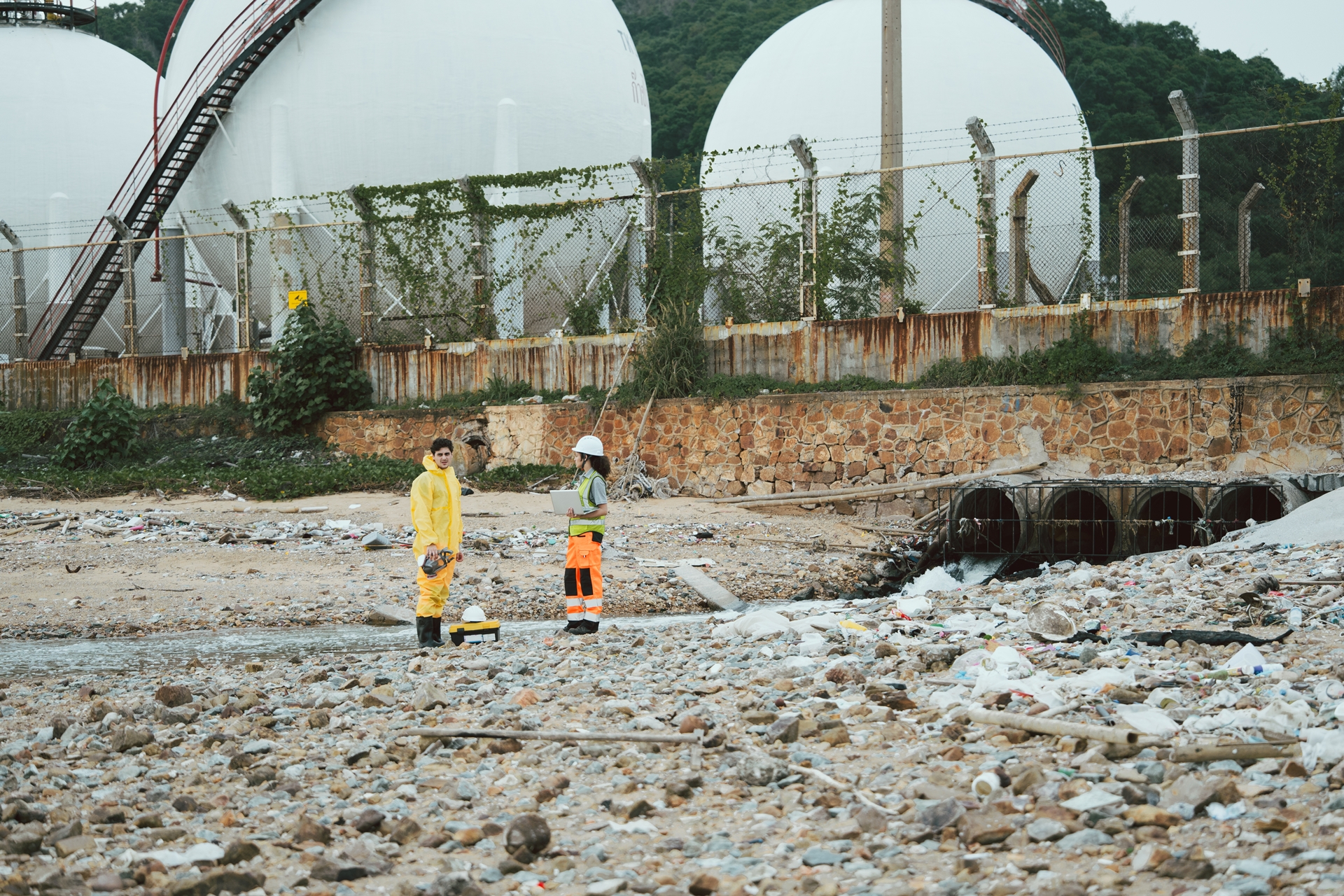 PFAS concept - workers inspect waste water